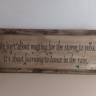 Metal Fleur De Lis accented dish with 4 large decorative balls and a sawdust city wood sign with saying.