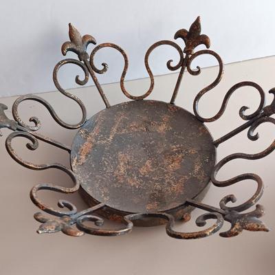 Metal Fleur De Lis accented dish with 4 large decorative balls and a sawdust city wood sign with saying.