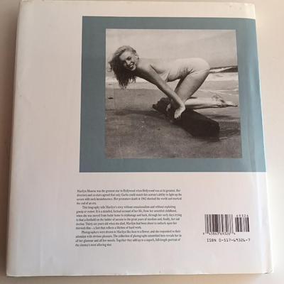 Two hardback books - Marilyn Monroe - Too young to Die & Photographs from the file of United Press International