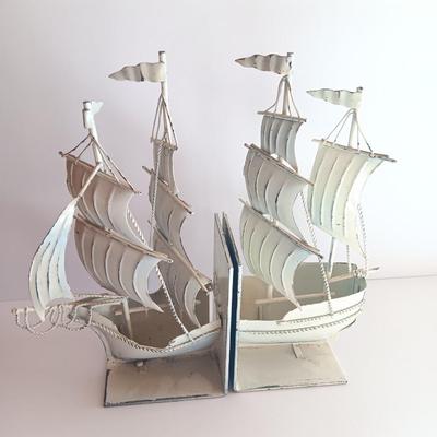 Nautical home decor - metal ship book ends with captains' wheel decor.
