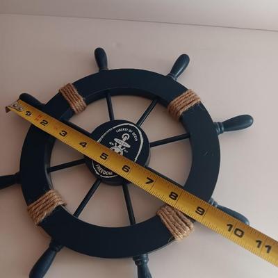Nautical home decor - metal ship book ends with captains' wheel decor.