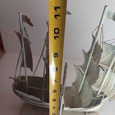 Nautical home decor - metal ship book ends with captains' wheel decor.
