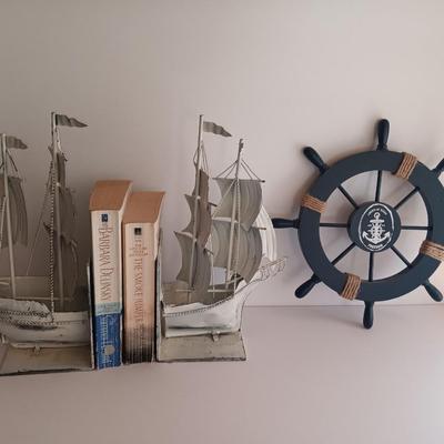 Nautical home decor - metal ship book ends with captains' wheel decor.
