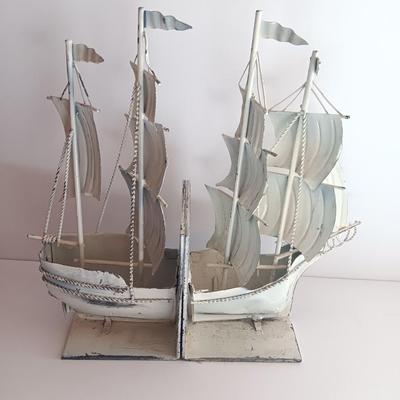 Nautical home decor - metal ship book ends with captains' wheel decor.