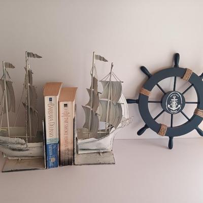 Nautical home decor - metal ship book ends with captains' wheel decor.