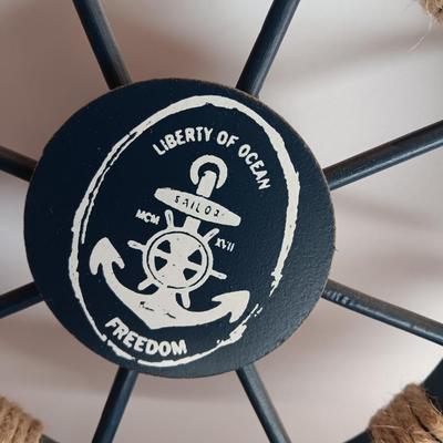 Nautical home decor - metal ship book ends with captains' wheel decor.