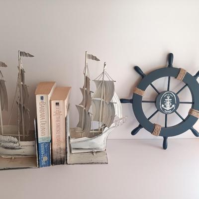 Nautical home decor - metal ship book ends with captains' wheel decor.