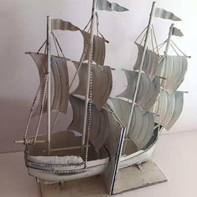 Nautical home decor - metal ship book ends with captains' wheel decor.