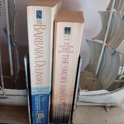 Nautical home decor - metal ship book ends with captains' wheel decor.