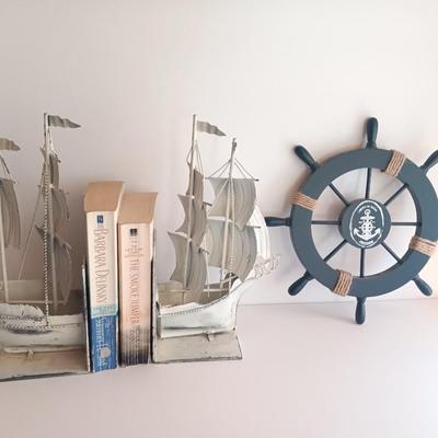 Nautical home decor - metal ship book ends with captains' wheel decor.