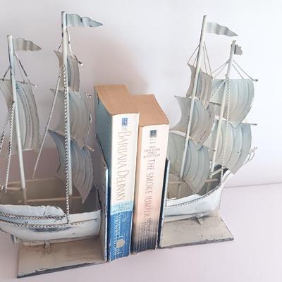 Nautical home decor - metal ship book ends with captains' wheel decor.