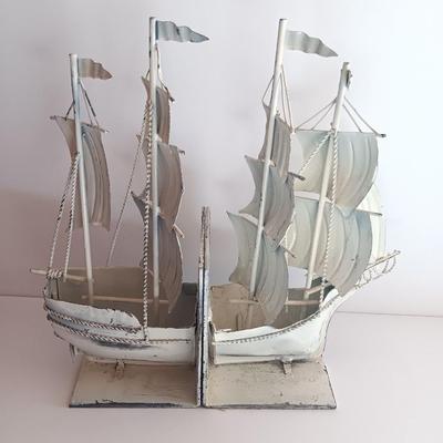 Nautical home decor - metal ship book ends with captains' wheel decor.