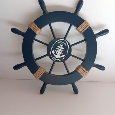 Nautical home decor - metal ship book ends with captains' wheel decor.