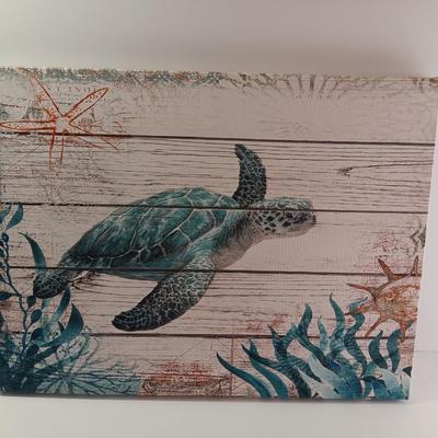 Canvas turtle wall art with driftwood and new candle