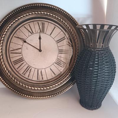 Roman numeral wall clock with woven metal vase decor