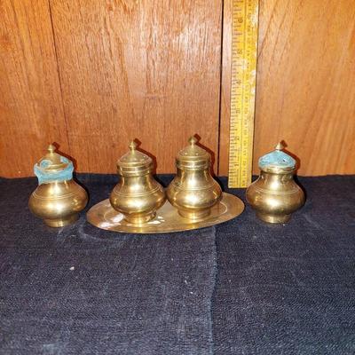 Two sets of brass salt and pepper shakers