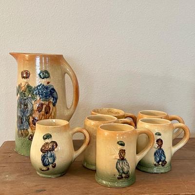 Antique Roseville pitcher and mugs