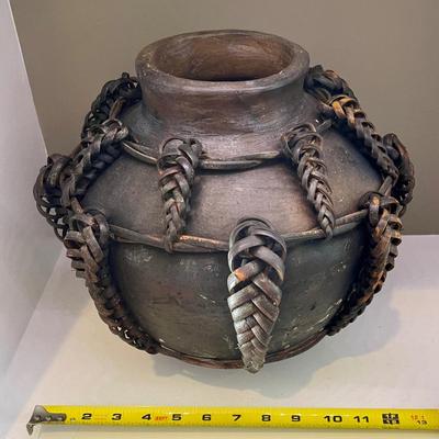 African jug pot with braided leather strap