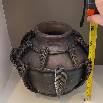 African jug pot with braided leather strap