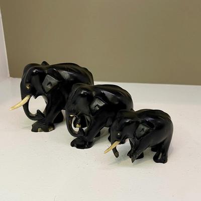 Hand carved ebony family of elephants