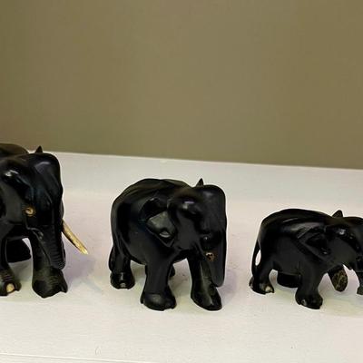 Hand carved ebony family of elephants