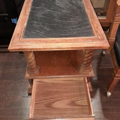 Mersman Wooden end table with drawer and leather like top with Black cushioned armchair