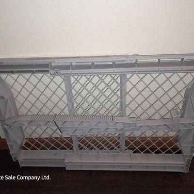 White plastic adjustable child / dog gate