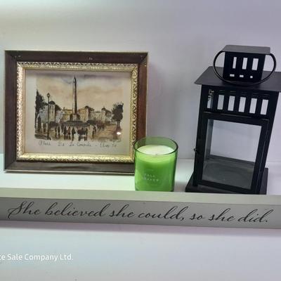 Framed picture - metal lantern - fall scented candle and "She believed she could, so she did" decor.