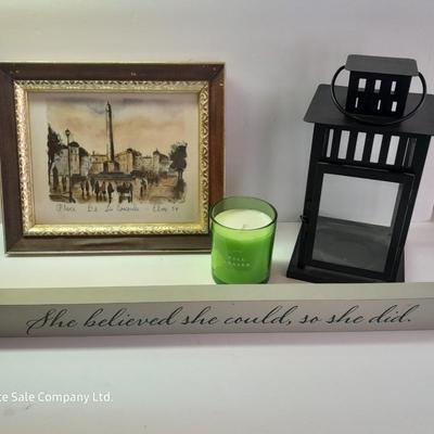 Framed picture - metal lantern - fall scented candle and "She believed she could, so she did" decor.