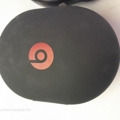 Fold up BEATS headphones with case.