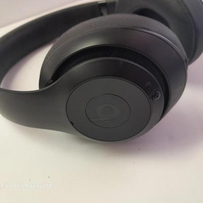 Fold up BEATS headphones with case.