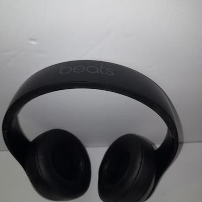 Fold up BEATS headphones with case.