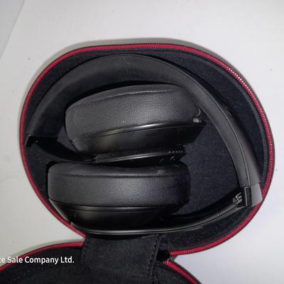 Fold up BEATS headphones with case.