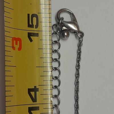 Necklace with matching earrings White and black with silver color design.