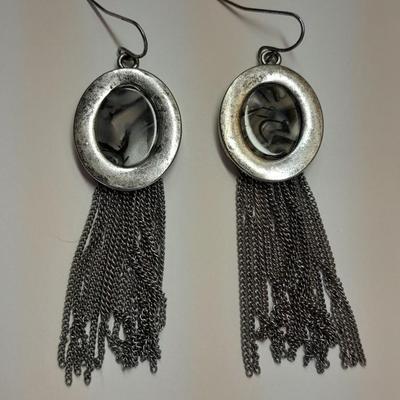 Necklace with matching earrings White and black with silver color design.