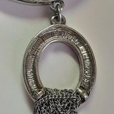 Necklace with matching earrings White and black with silver color design.