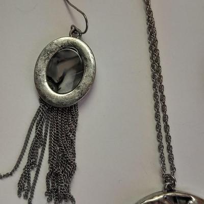 Necklace with matching earrings White and black with silver color design.