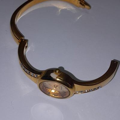Three Women's watches - Anne Klein II - Gossip - and gold toned band with rhinestones.