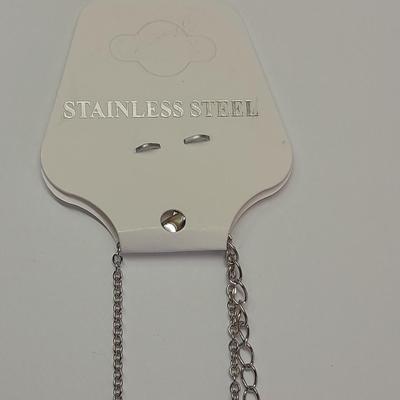 Two necklaces - Plunder and silver toned pendant with chains.