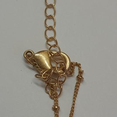 Two necklaces - Plunder and silver toned pendant with chains.