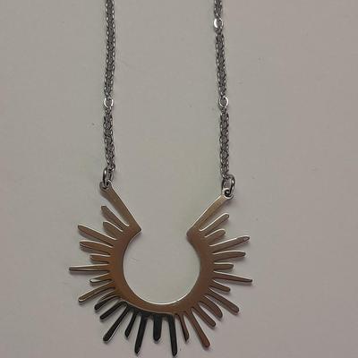 Two necklaces - Plunder and silver toned pendant with chains.