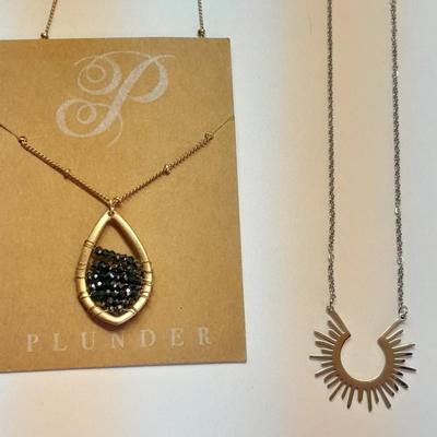 Two necklaces - Plunder and silver toned pendant with chains.