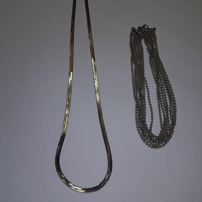 Two fun and fancy silver toned necklaces - chains