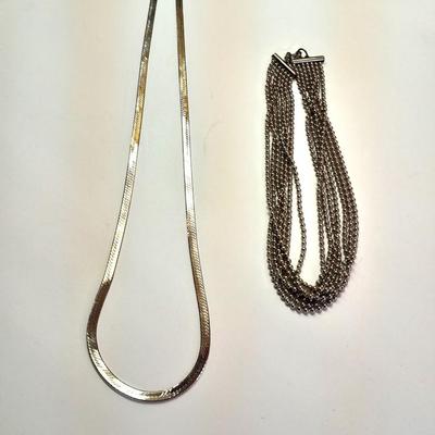 Two fun and fancy silver toned necklaces - chains