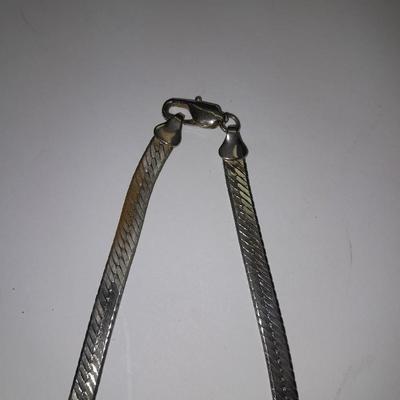 Two fun and fancy silver toned necklaces - chains