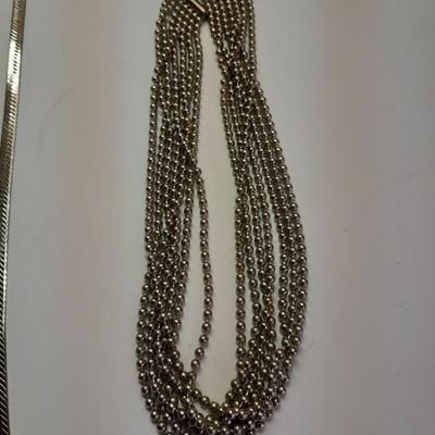 Two fun and fancy silver toned necklaces - chains