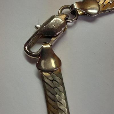 Two fun and fancy silver toned necklaces - chains