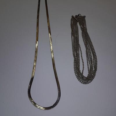 Two fun and fancy silver toned necklaces - chains