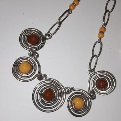 Beaded necklaces and a couple silver toned bracelets.