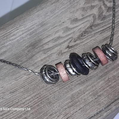 Beaded necklaces and a couple silver toned bracelets.